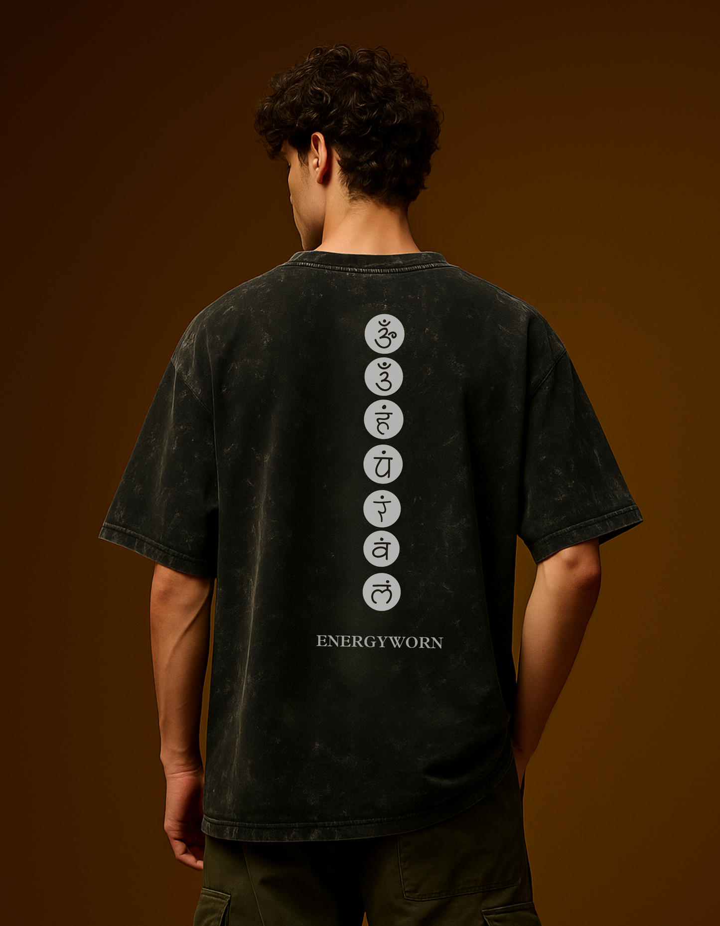 Back view of the Aham Brahmasmi Acid Tee from GodHit's ENERGYWORN collection featuring chakra alignment symbols.