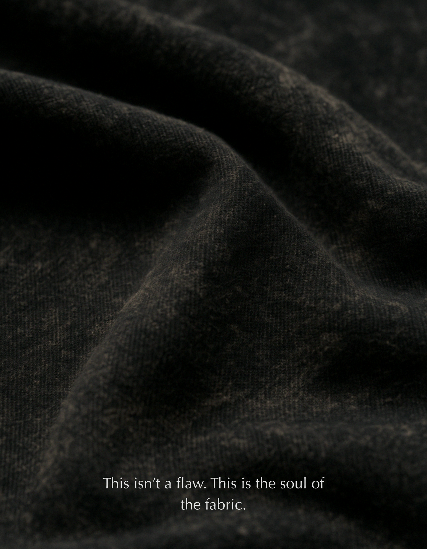Close-up of premium acid-washed cotton fabric on the Aham Brahmasmi Acid Tee, showing texture and softness.