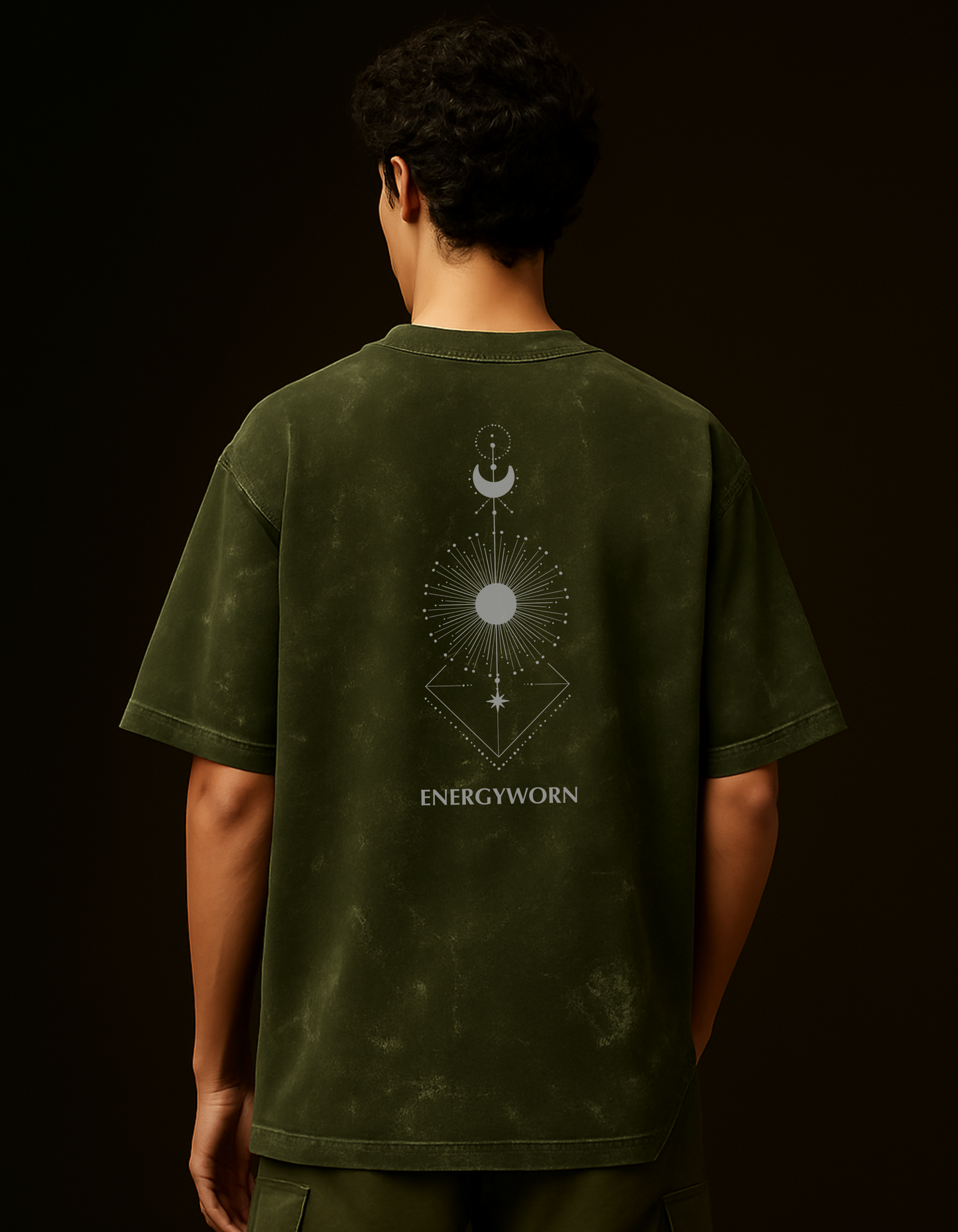 Back view of Chakra Backflow Tee in olive green with cosmic light symbol and ENERGYWORN branding.