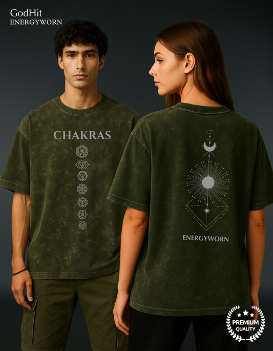 Male and female models wearing GodHit Chakra Backflow Oversized Olive Green T-Shirt with sacred 7 chakras and cosmic backflow print. Part of the ENERGYWORN spiritual series.
