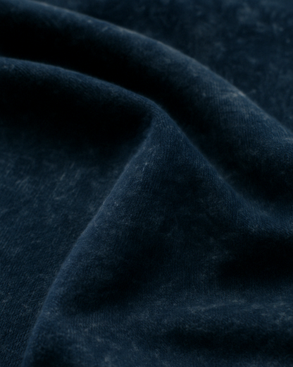 Textured closeup of Navy Blue acid-wash cotton fabric – authentic look